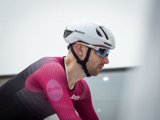 Tom riding in the wind tunnel wearing an aero helmet